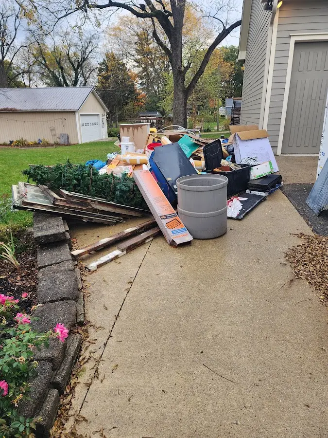 Dumpster being loaded with debris for 3 Yard Dumpster Rental in East Haven